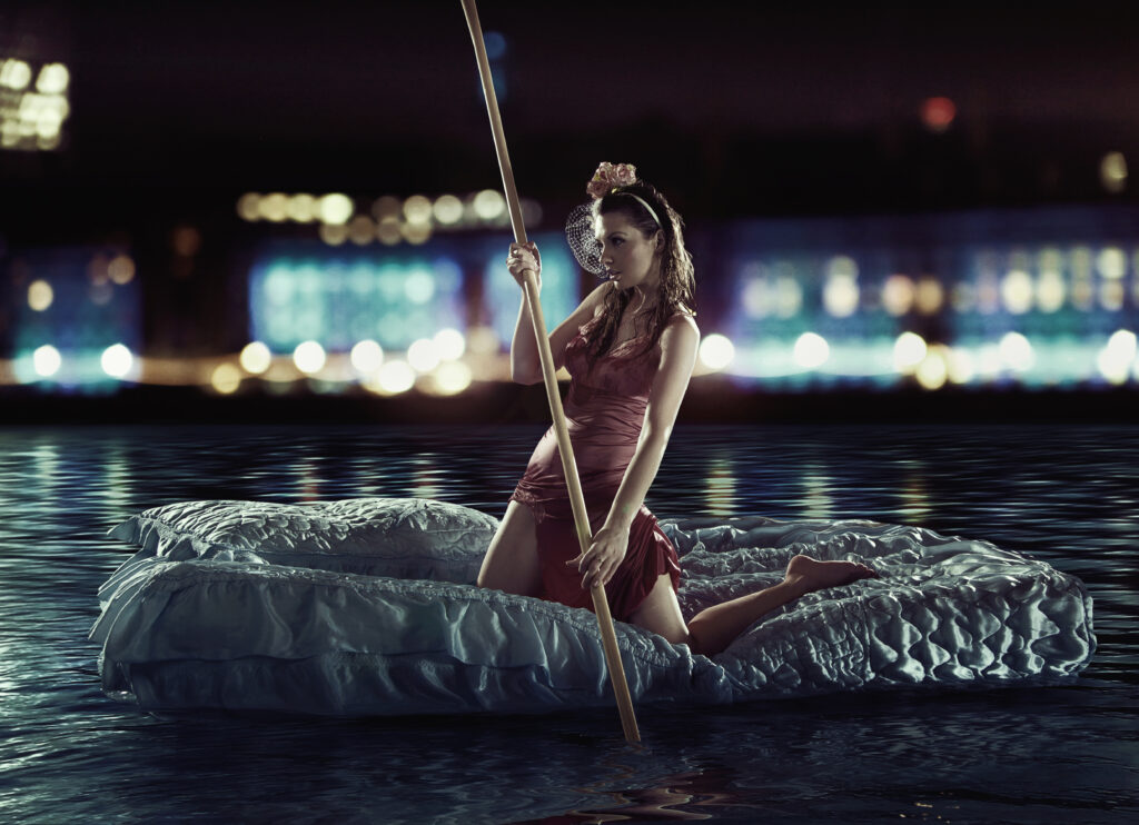 Great photo of an attractive sculling woman  